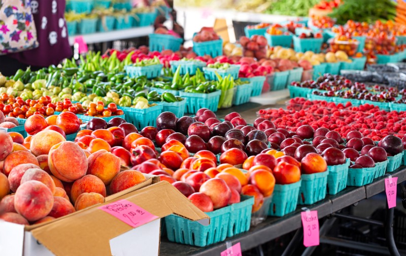 Variety of fruit and vegetables at a community outdoor market